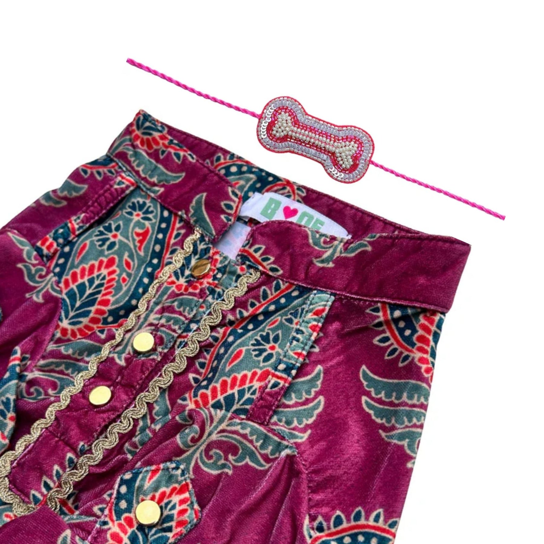 MAGENTA VELVET PAISLEY PRINTED KURTA + SILVER PINK PEARL BONE RAKHI FOR DOGS AND CATS