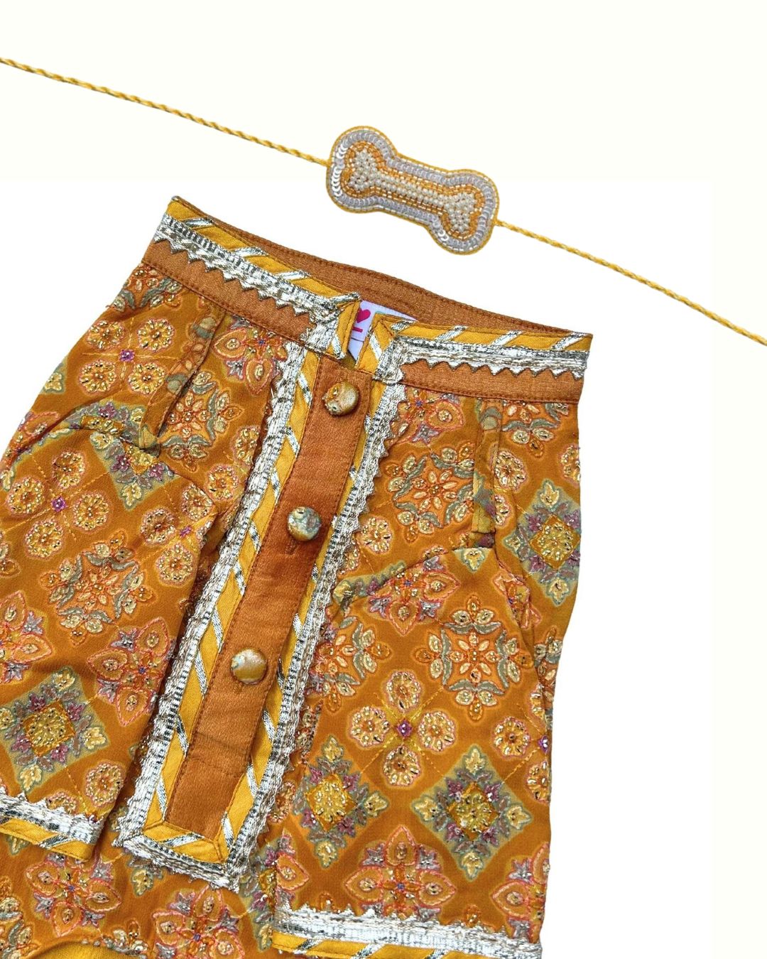 MUSTARD YELLOW PATIALA MOTIF DOG KURTA+SILVER YELLOW PEARL BONE RAKHI FOR DOGS AND CATS