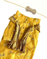 MUSTARD YELLOW TISSUE BUTI DOG KURTA+SILVER YELLOW PEARL BONE RAKHI FOR DOGS AND CATS